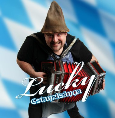 Die Grafik zeigt Comedian Lucky Luckas mit einem Schifferklavier auf blauem Hintergrund.
